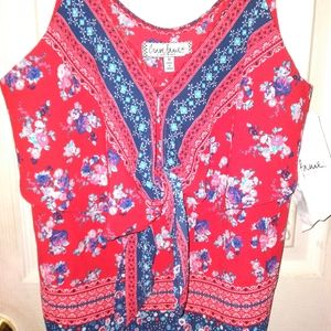 A spaghetti strap shirt with a floral design